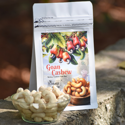 Goan Cashew pouch with glass bowl of whole cashews – Premium dry fruits.
