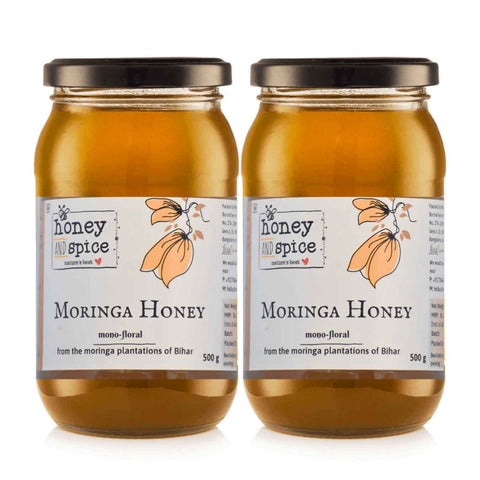 Two Moringa Honey jars front-facing – highlighting label design and glass jar packaging