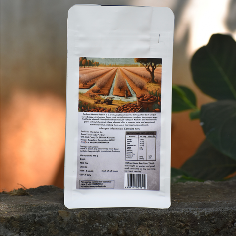 Back of Kashmiri Badam pack – Almond orchard illustration and detailed nutrition label in sunlight.