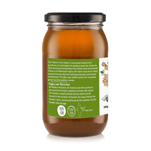 Side view of Buckwheat Honey jar showcasing the product's green label and nutritional highlights.