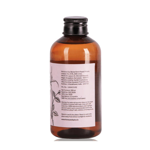 Side label of Rose Water showing ingredients, manufacturing info, and floral illustration