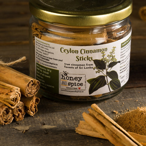 Ceylon Cinnamon Sticks jar – 50g of premium cinnamon with whole sticks on a rustic wooden surface.