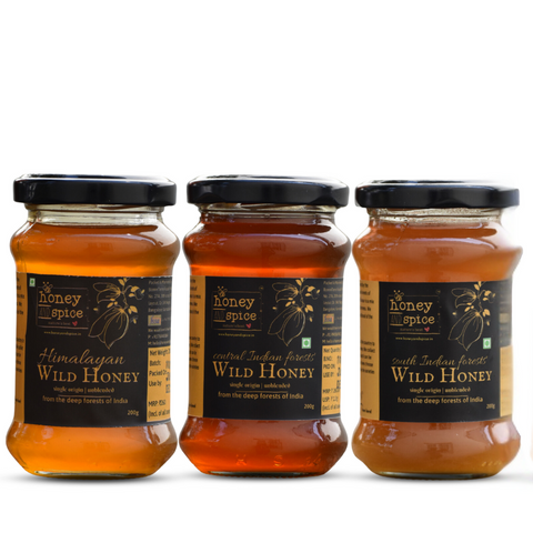 Front view of three jars of wild honey – Himalayan and South Indian forest varieties.