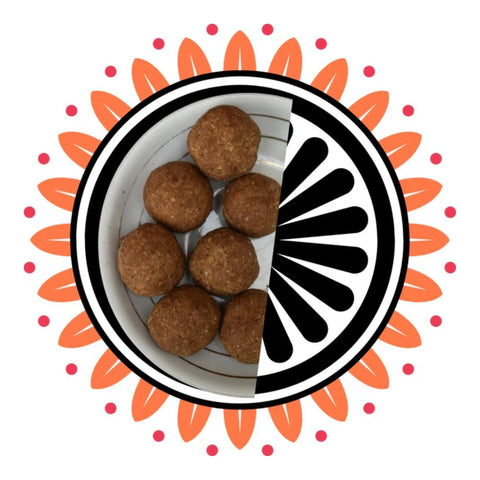 Super Laddoo in black bowl with festive backdrop