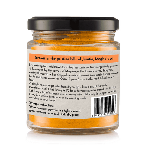Back label of Lakadong Turmeric jar detailing origins from Meghalaya and product benefits.