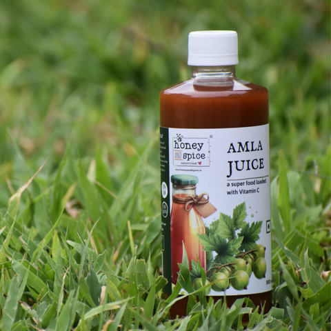 Amla Juice bottle on grass in outdoor view