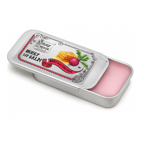 Honey Spice lip balm in a metal tin on a white background