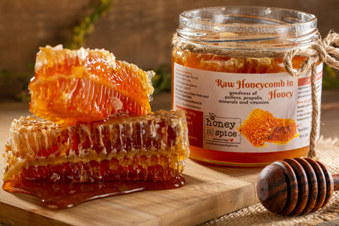 Raw Honeycomb in Honey jar paired with honeycomb pieces and honey dipper - natural sweetness.