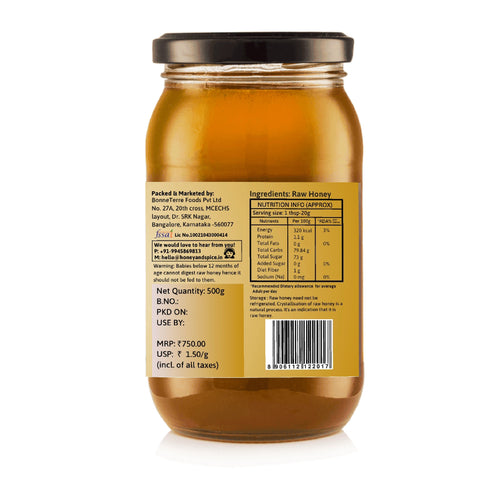 Back view of Moringa Honey jar with barcode, ingredients, and manufacturing information