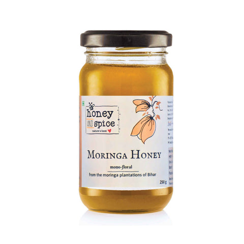 Angled front view of Moringa Honey showcasing clarity and consistency