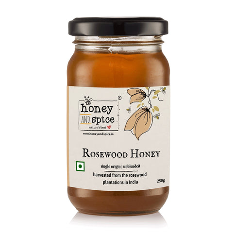 Close-up front view of Rosewood Honey with label text visible
