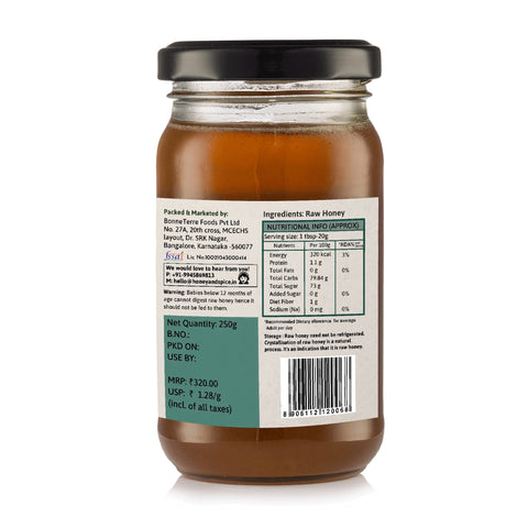 Left angle view of Tropical Blossom honey showing barcode and nutritional info