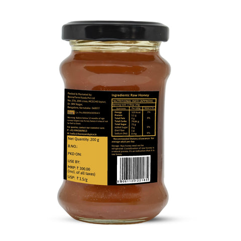 Back label of wild honey jar showing nutrition facts and product details.