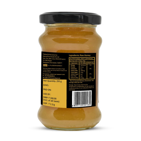 Label on the back of a light wild honey jar with nutrition facts and barcode.