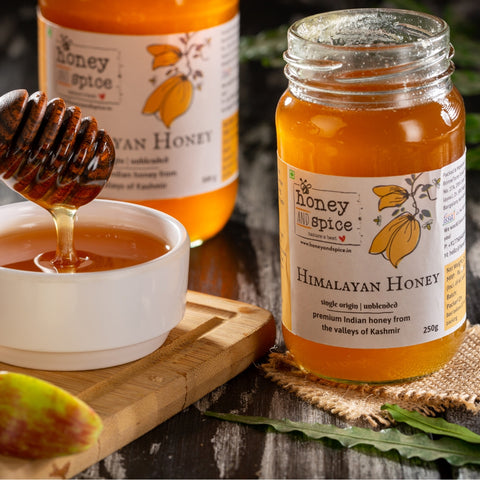Jars of Himalayan Honey with dipper and bowl, made from Kashmir valley honey.