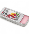 Honey Spice lip balm in a metal tin on a white background